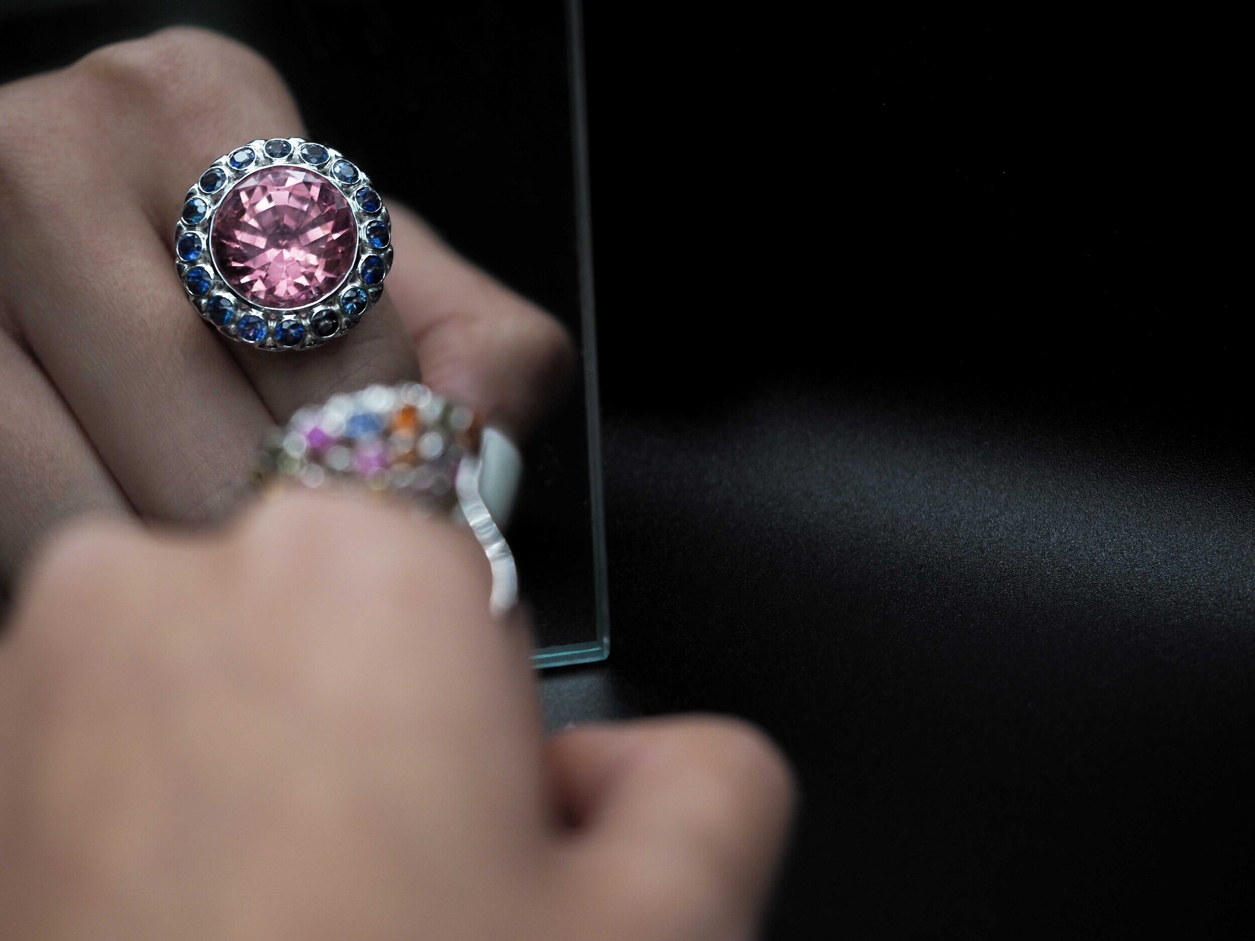 Expressive pink gemstone ring worn on a hand