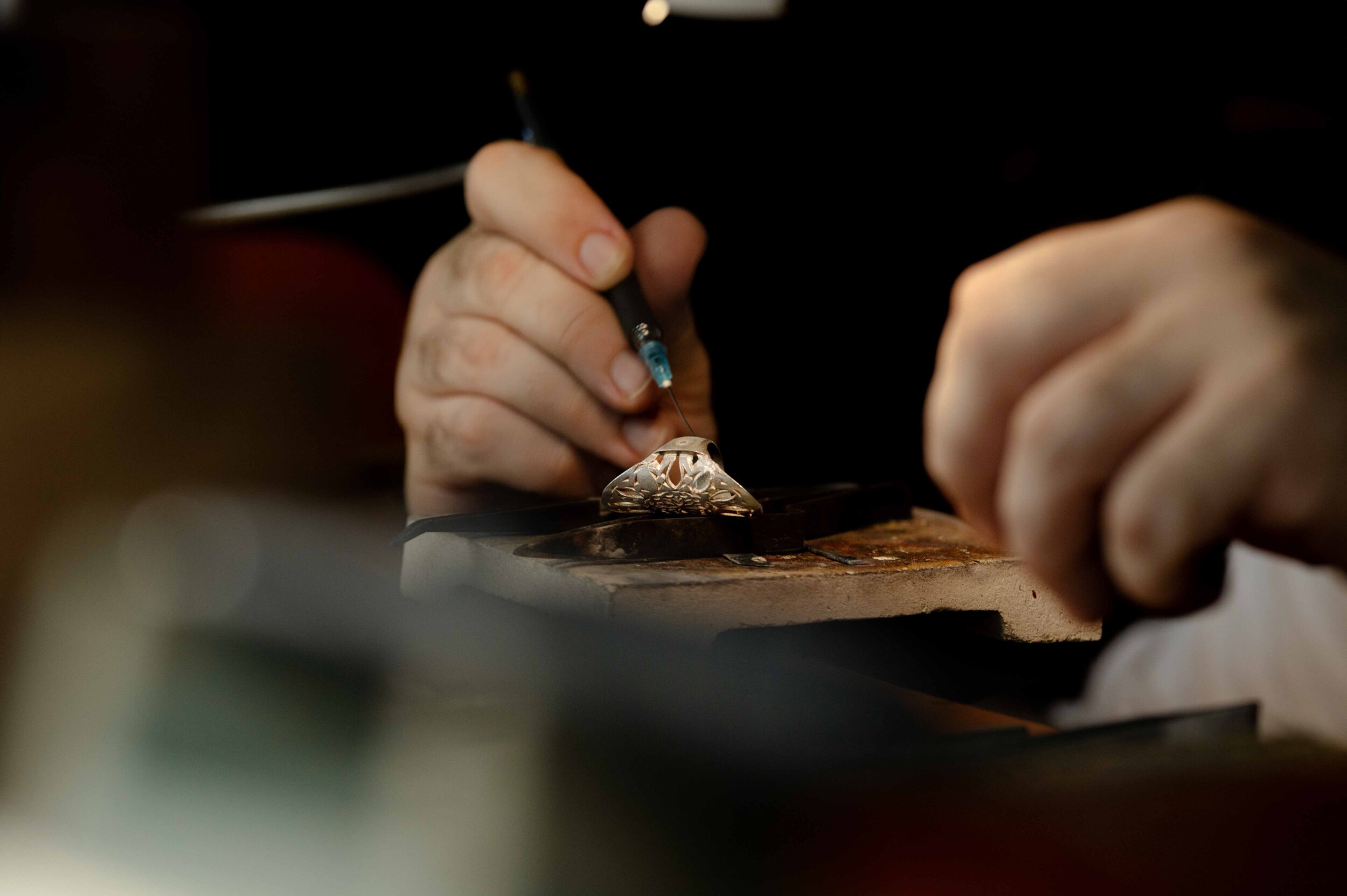 Artisan working carefully on a piece of jewelry